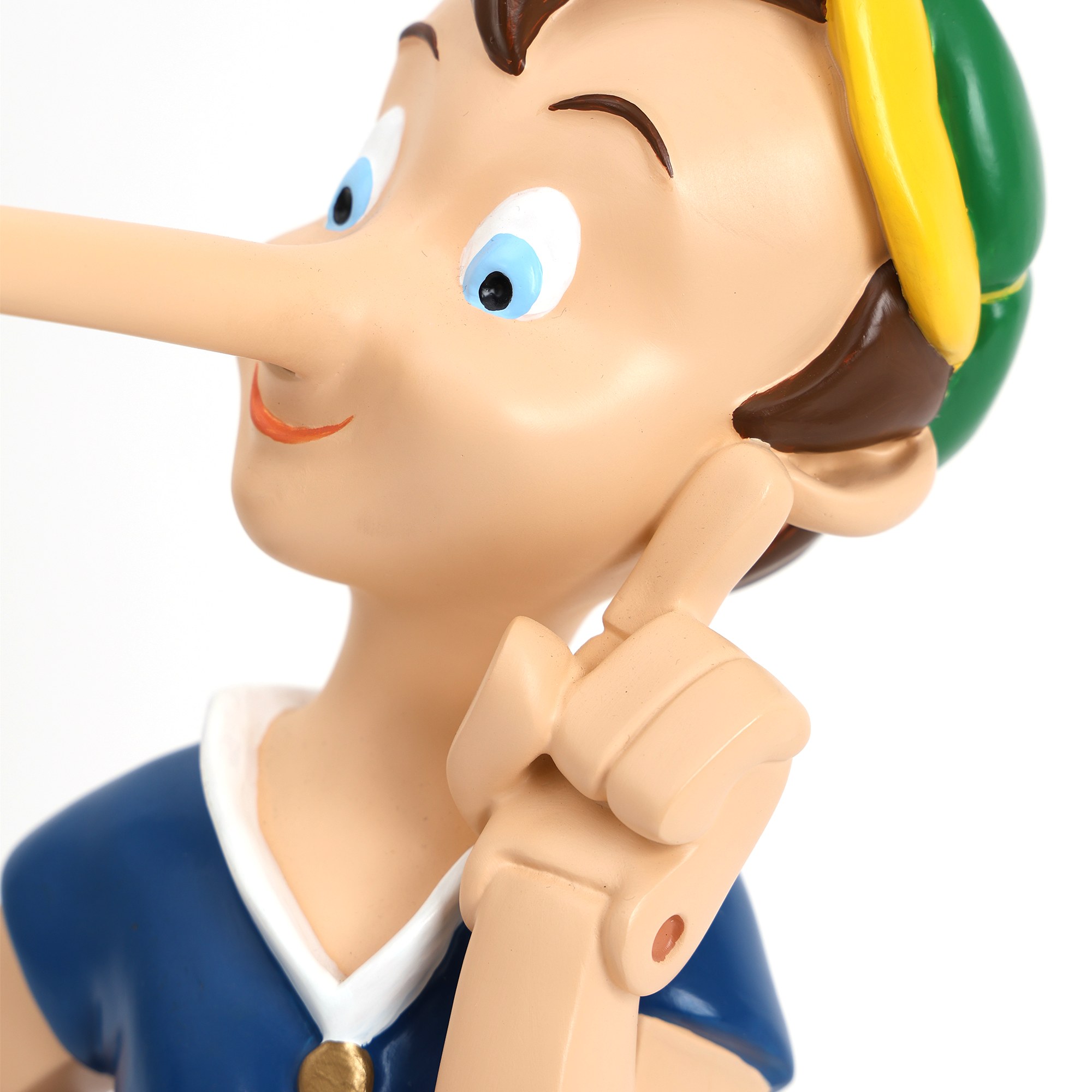 Lampe Pinocchio The Liar rechargeable par Seletti Détail du visage en résine peinte de la lampe Pinocchio Seletti