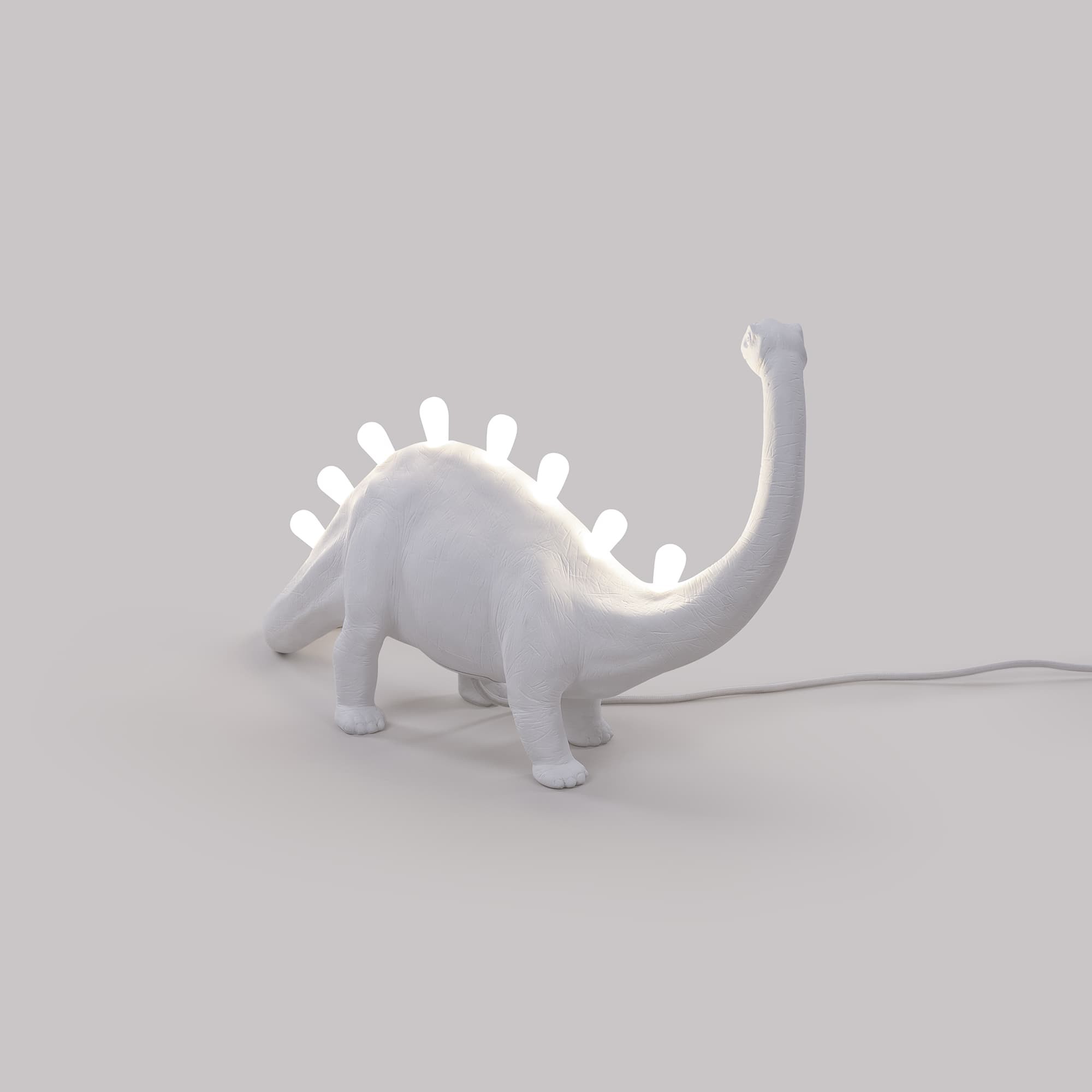 Lampe à poser Jurassic Lamp Bronto en forme de brontosaure en résine blanc par Seletti
