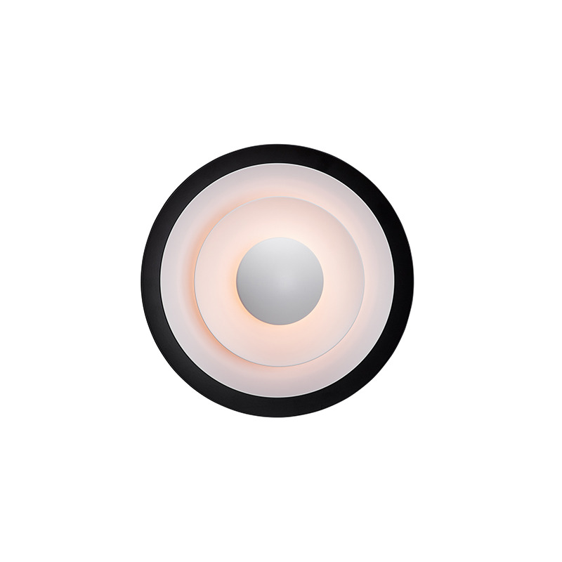 7 idées de luminaires design pour transformer l'ambiance de votre salon Applique Diablo base en métal en forme circulaire plate au design contemporain par Belid